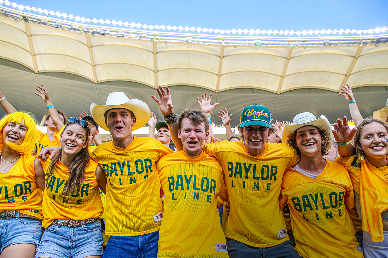 Students in the Baylor Line cheering at a football game