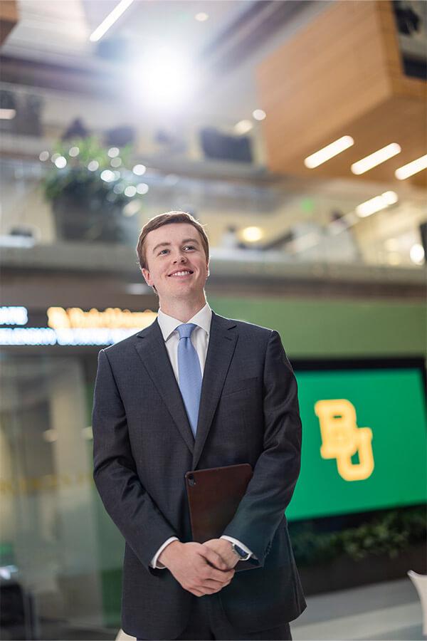 A young man wearing a suit 